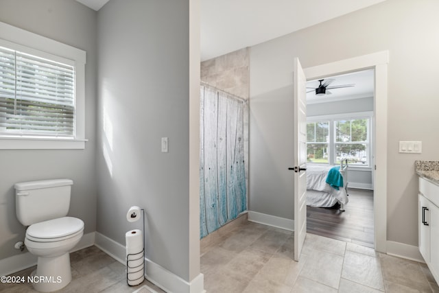 bathroom featuring curtained shower, vanity, toilet, ceiling fan, and hardwood / wood-style floors