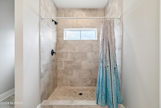 bathroom with a shower with shower curtain