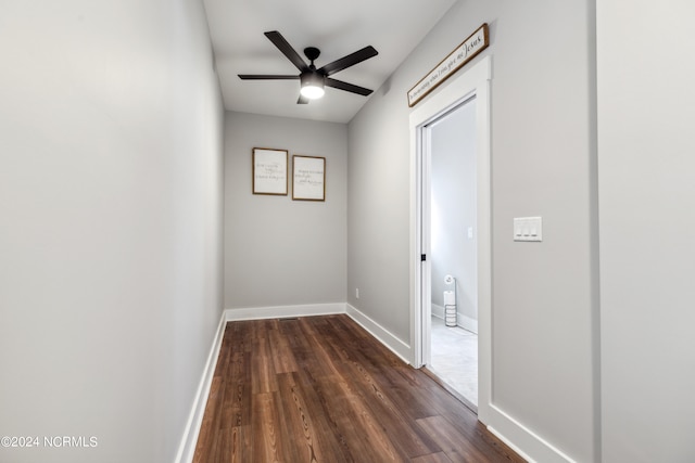 corridor with dark wood-type flooring