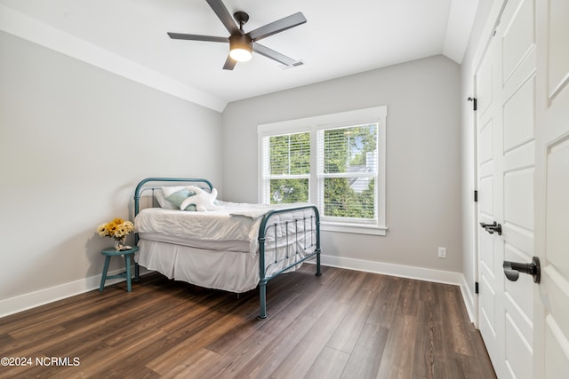 bedroom featuring vaulted ceiling, ceiling fan, and dark hardwood / wood-style flooring