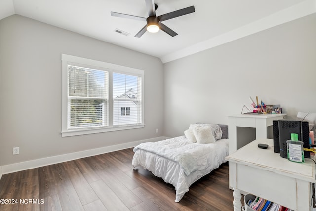 bedroom with lofted ceiling, dark wood-type flooring, and ceiling fan