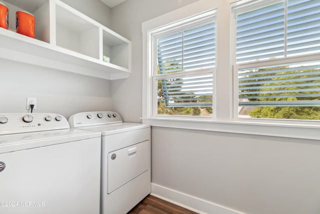 washroom with a wealth of natural light, dark hardwood / wood-style floors, and washer and dryer