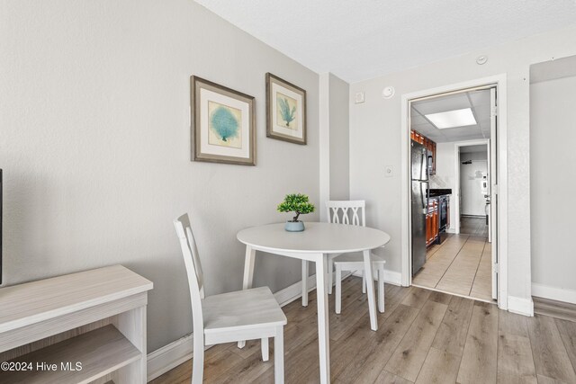 1501 S Ocean Blvd Unit 1235, Myrtle Beach, SC 29577 - dining room featuring light wood-style floors and baseboards