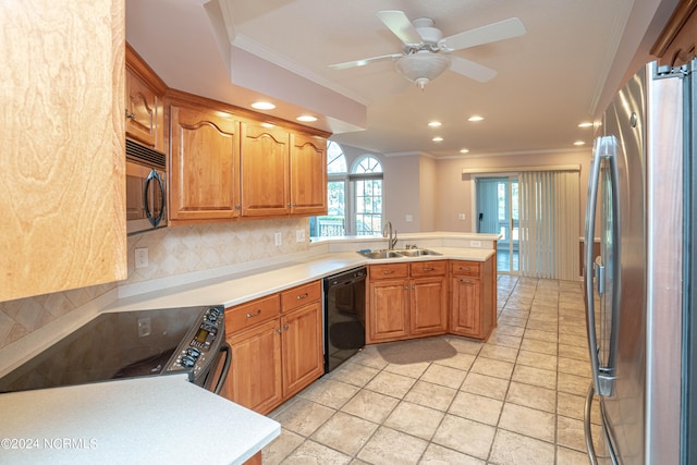 kitchen featuring sink, black appliances, kitchen peninsula, ceiling fan, and ornamental molding