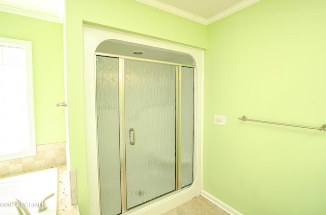 bathroom with ornamental molding, a healthy amount of sunlight, tile patterned floors, and shower with separate bathtub