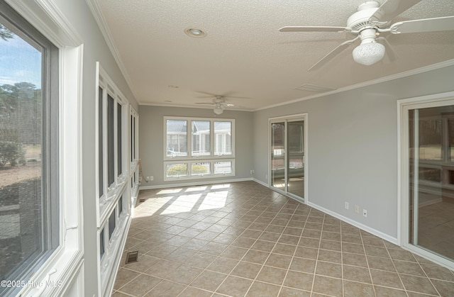 unfurnished sunroom featuring ceiling fan