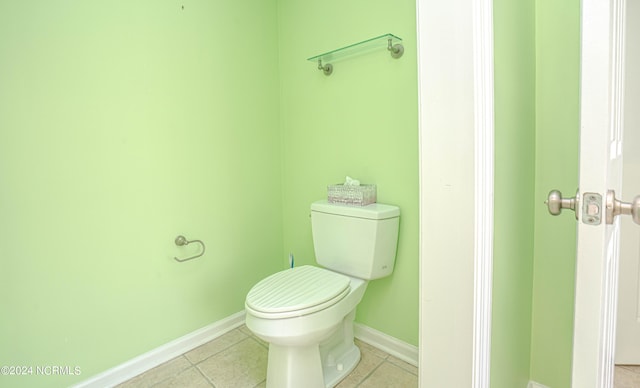 bathroom featuring toilet and tile patterned floors