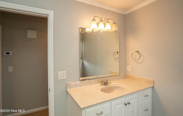 bathroom with crown molding and vanity