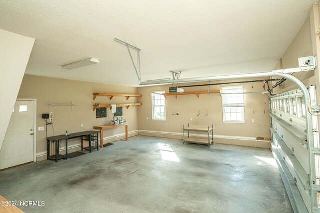 laundry room featuring a textured ceiling, cabinets, separate washer and dryer, light tile patterned floors, and sink