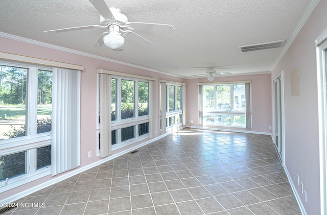 unfurnished sunroom featuring ceiling fan