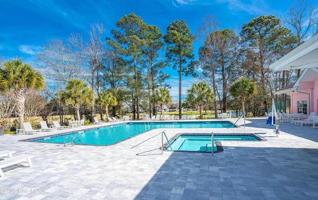 view of swimming pool featuring a patio area