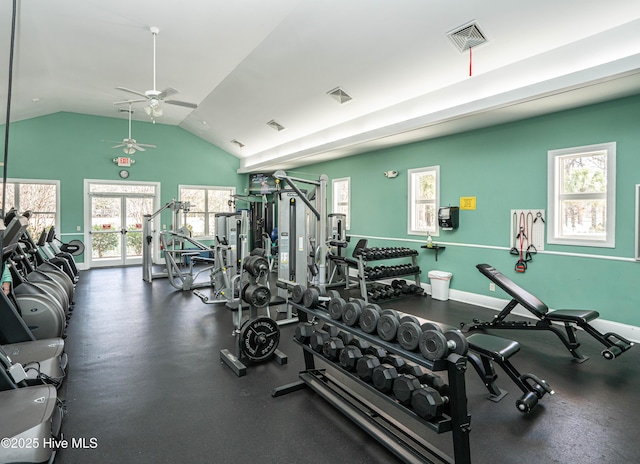 exercise room with ceiling fan, vaulted ceiling, and a wealth of natural light