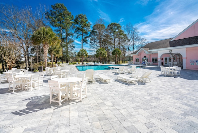 view of swimming pool with a patio