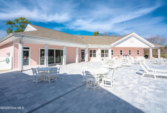 back of house with a patio