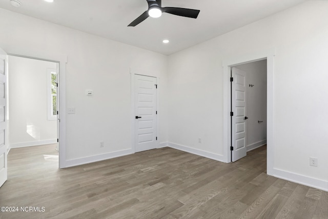 unfurnished bedroom with light wood-style floors, recessed lighting, baseboards, and ceiling fan