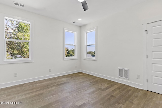 unfurnished room featuring hardwood / wood-style floors and ceiling fan