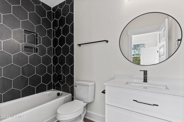full bathroom featuring baseboards, bathing tub / shower combination, toilet, and vanity