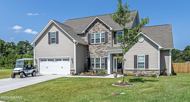 view of front facade with a front yard and a garage