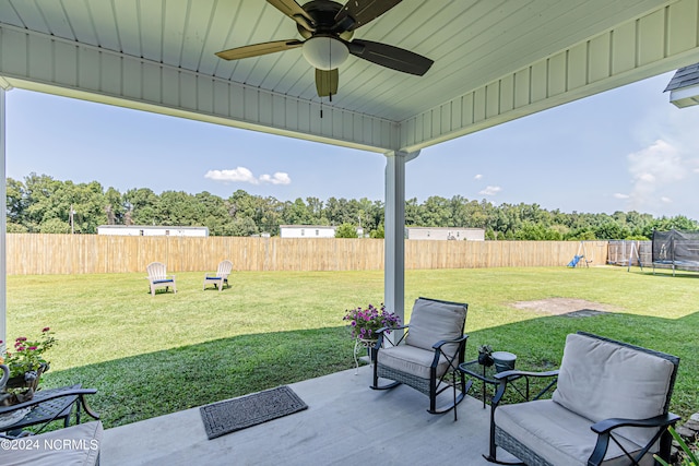 view of patio with a trampoline and ceiling fan