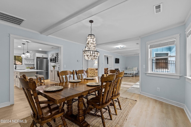 dining space featuring ornamental molding, light hardwood / wood-style flooring, a chandelier, and beam ceiling