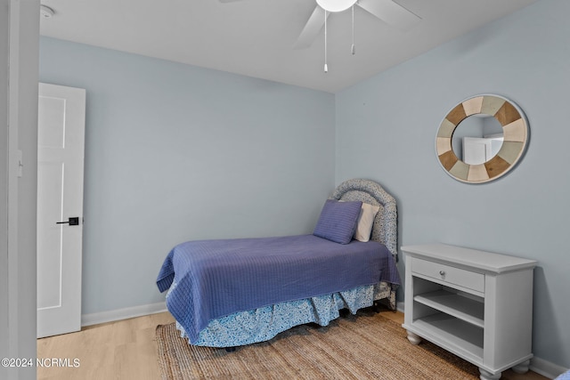 bedroom featuring light hardwood / wood-style floors and ceiling fan