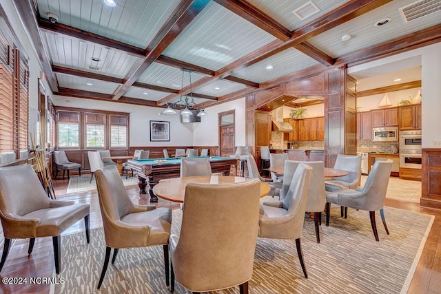 dining space featuring coffered ceiling, billiards, and beam ceiling