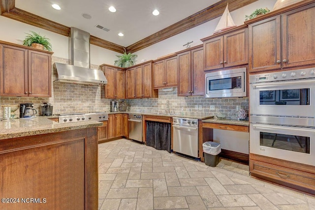 kitchen featuring appliances with stainless steel finishes, decorative backsplash, ornamental molding, light stone counters, and wall chimney exhaust hood