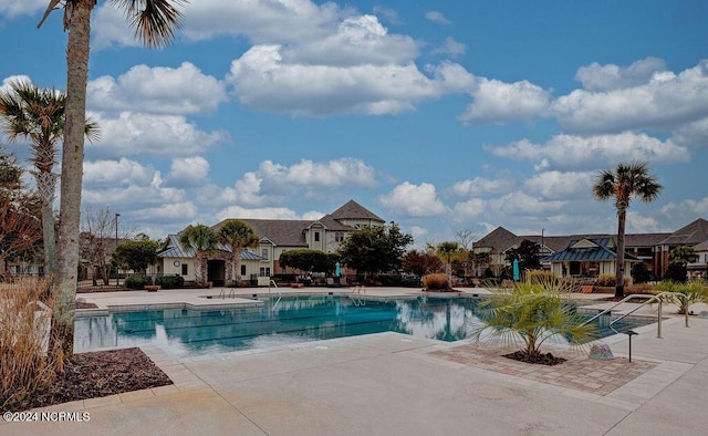 view of swimming pool featuring a gazebo and a patio