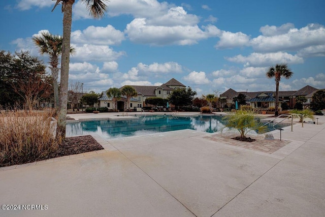 view of pool featuring a patio area