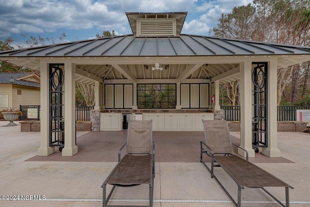 view of patio featuring a gazebo and wine cooler