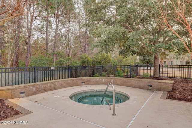 view of pool with a community hot tub