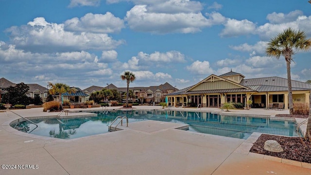 view of swimming pool featuring a patio area