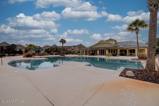 view of swimming pool featuring a patio area