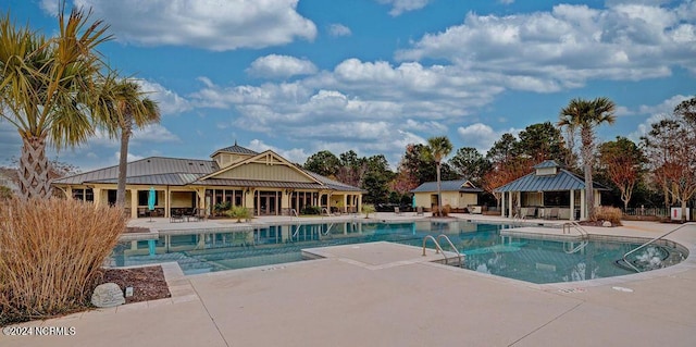 view of swimming pool with a patio