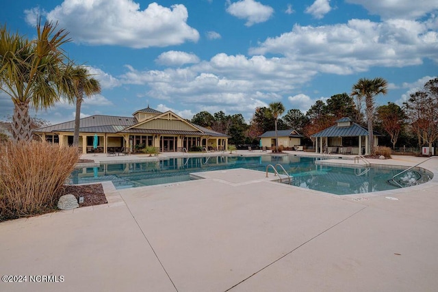 view of swimming pool featuring a gazebo and a patio