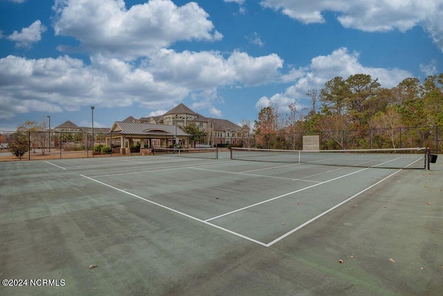 view of tennis court featuring a gazebo