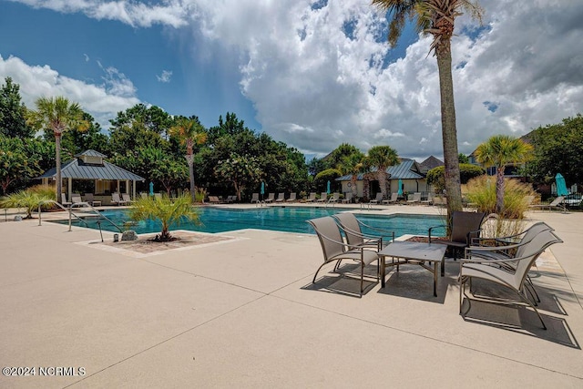 view of swimming pool with a gazebo and a patio