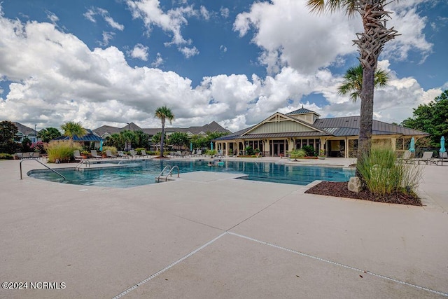 view of swimming pool featuring a patio area