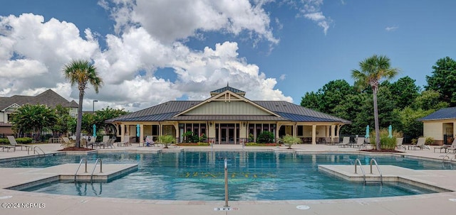 view of swimming pool with a patio area