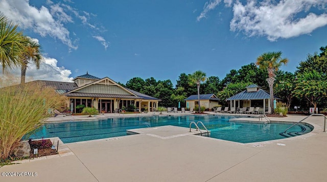 view of swimming pool with a patio area