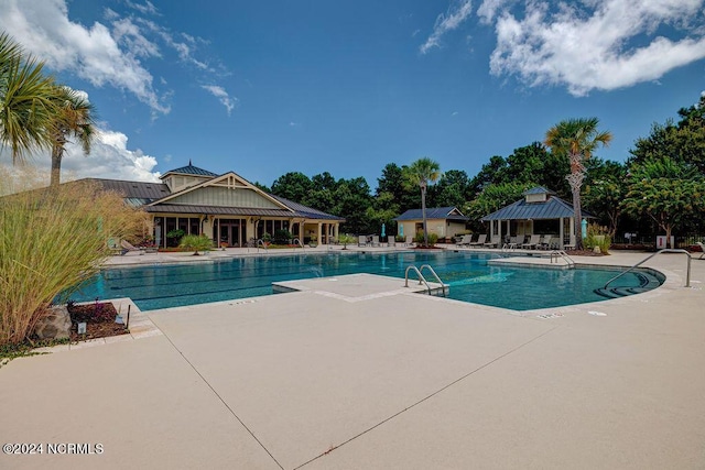 view of swimming pool featuring a gazebo and a patio