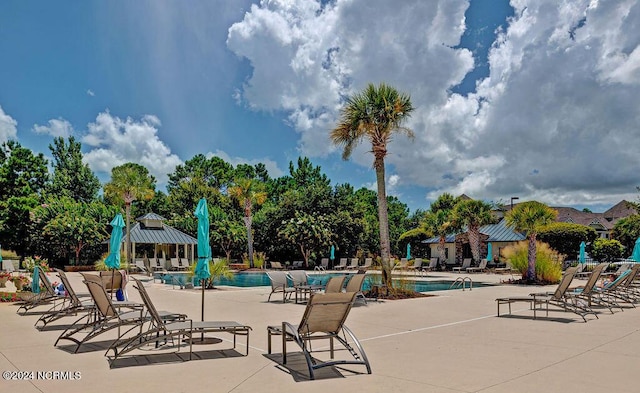 view of swimming pool with a gazebo and a patio area