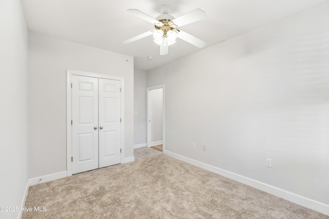 unfurnished bedroom with carpet floors, a closet, and ceiling fan