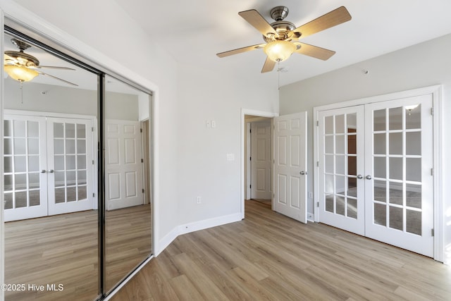 unfurnished bedroom with french doors, ceiling fan, and light wood-type flooring