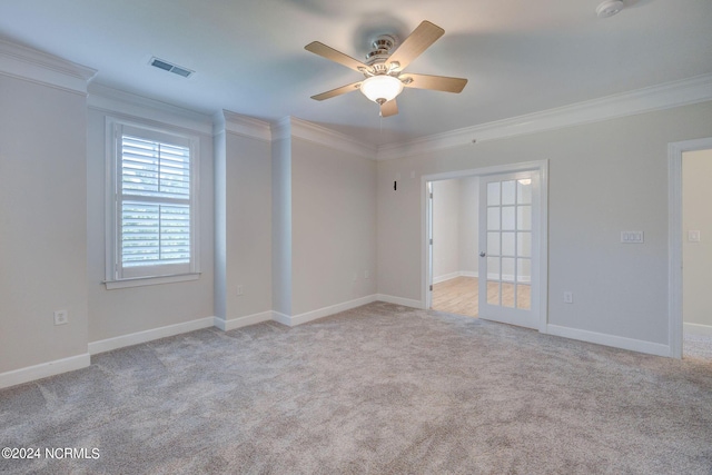 unfurnished room with light carpet, ornamental molding, and ceiling fan