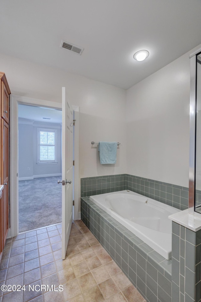 bathroom with tiled tub