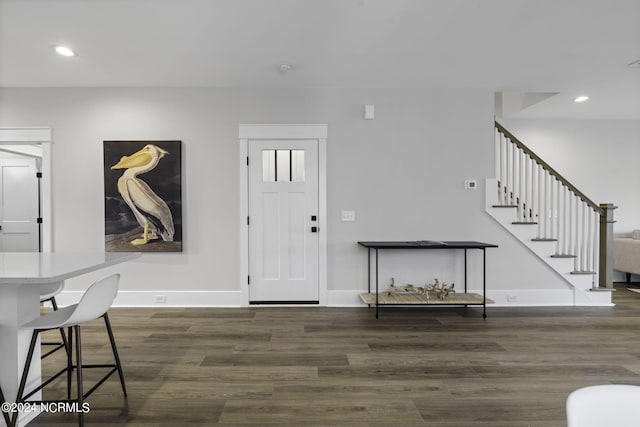 foyer with dark hardwood / wood-style flooring