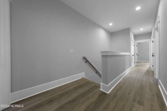 hall with dark hardwood / wood-style flooring