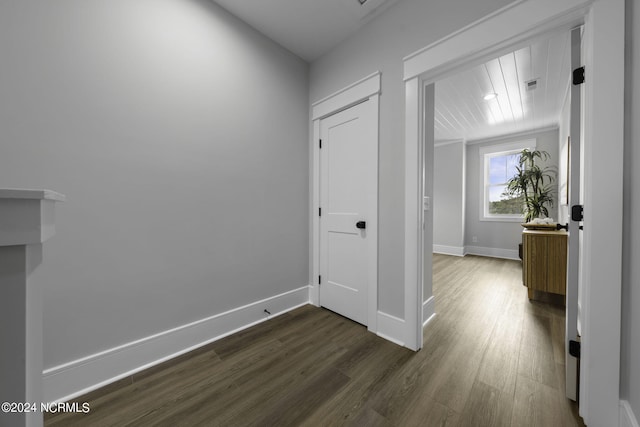 hall with dark hardwood / wood-style floors