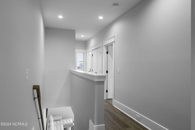 hallway with dark wood-type flooring